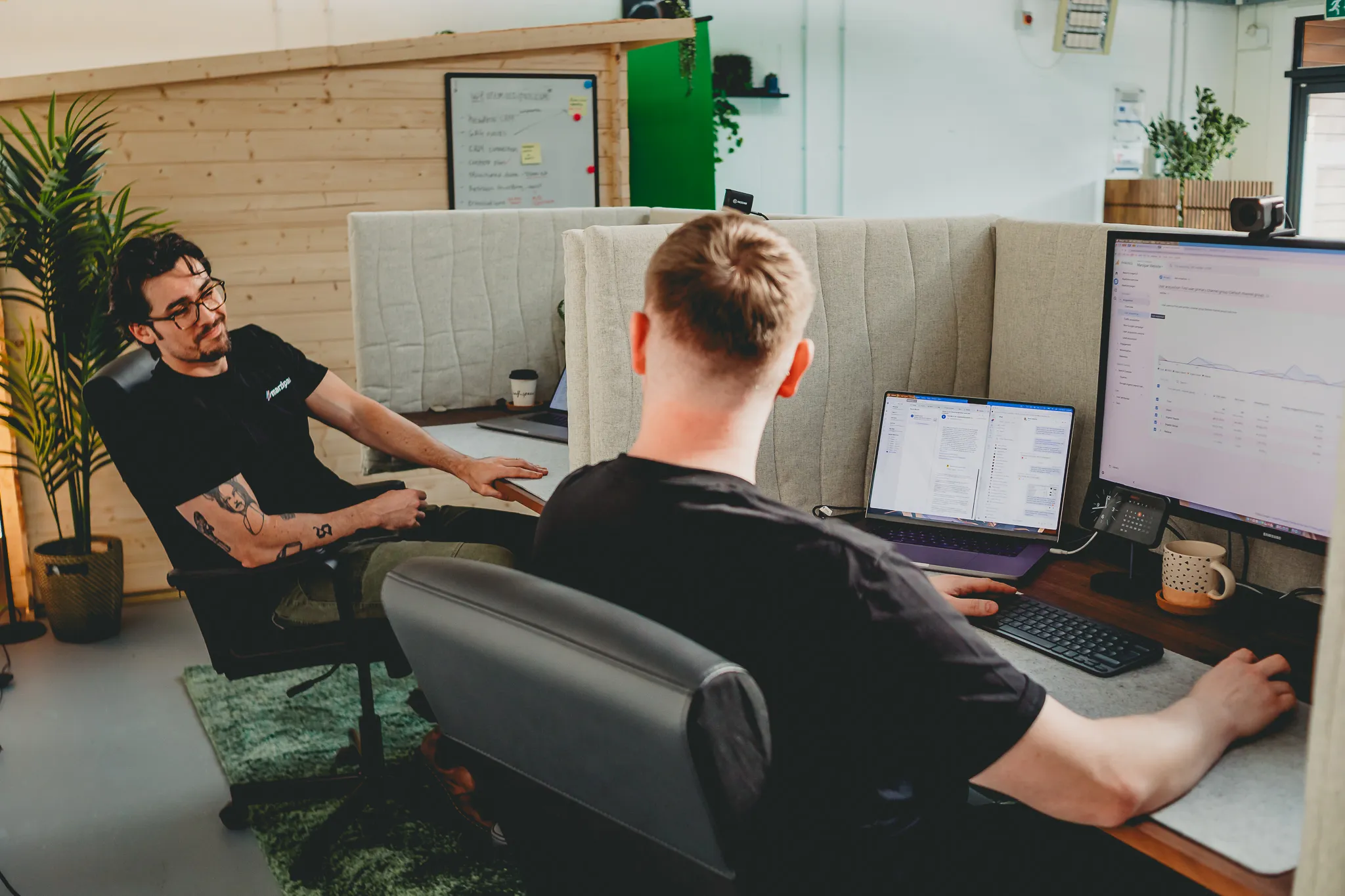 Two Marzipan team members reviewing a marketing analytics dashboard together