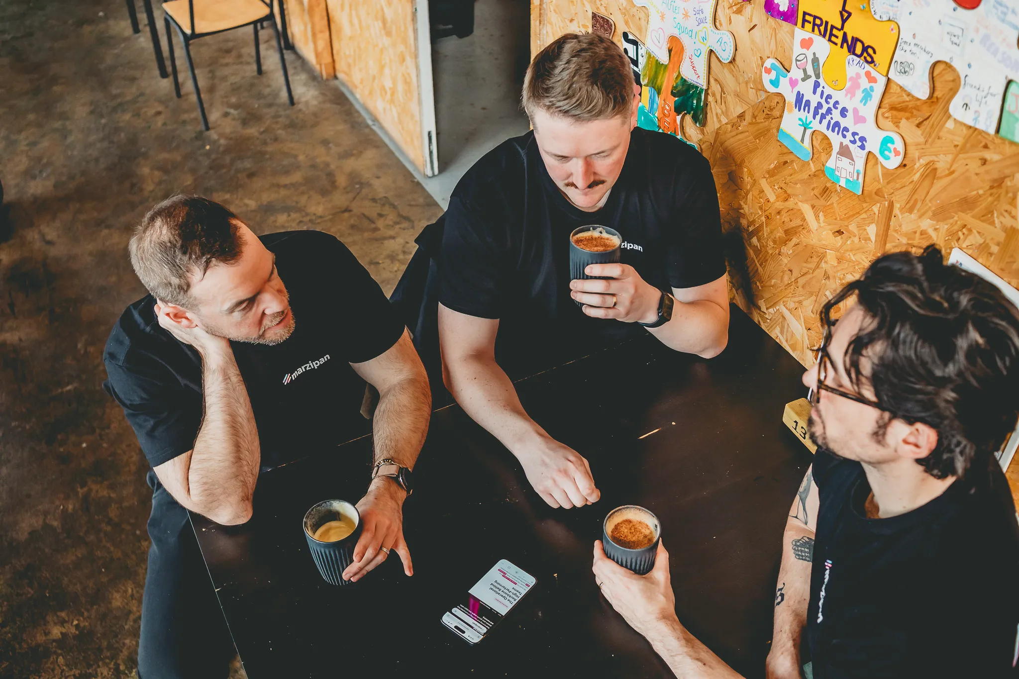 The Marzipan team reviewing coverage and results together over coffee