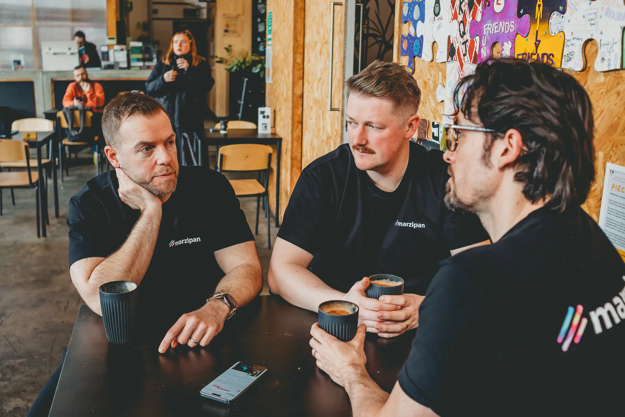 Team discussion over coffee